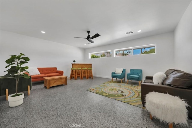 sitting room with speckled floor, a ceiling fan, baseboards, recessed lighting, and visible vents