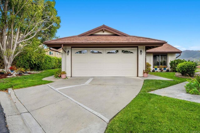 1109 Calle Del Baston, San Marcos, CA 92078 - single story home featuring driveway, stucco siding, a front yard, and a tiled roof