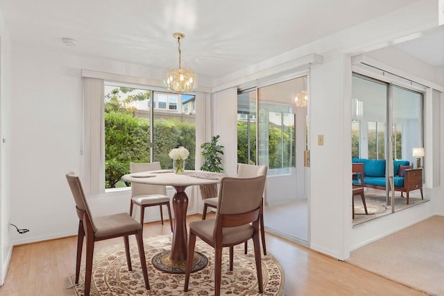 1109 Calle Del Baston, San Marcos, CA 92078 - dining area featuring a chandelier and light wood-style flooring