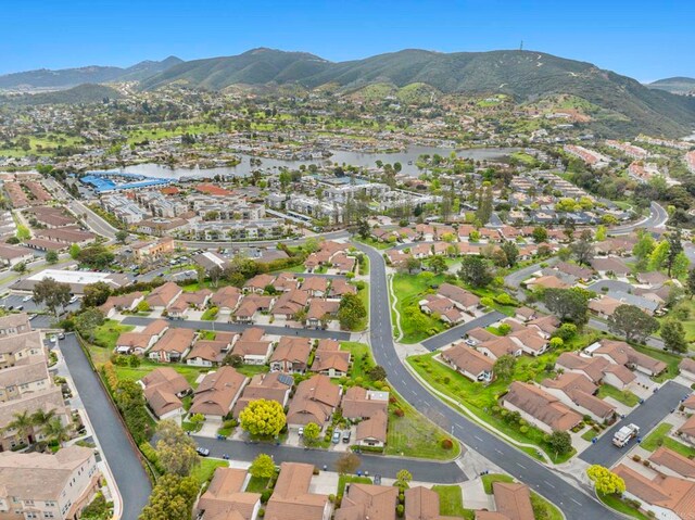 1109 Calle Del Baston, San Marcos, CA 92078 - aerial overview of property's location with nearby suburban area and a water and mountain view