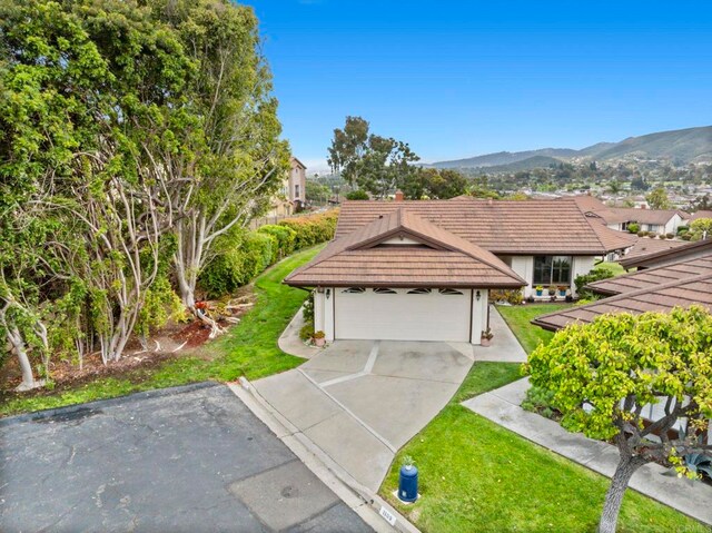 1109 Calle Del Baston, San Marcos, CA 92078 - ranch-style house with a front lawn, a mountain view, a tile roof, and a chimney