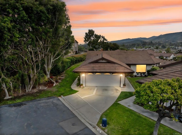 1109 Calle Del Baston, San Marcos, CA 92078 - view of front of home with a mountain view, a yard, and a tile roof