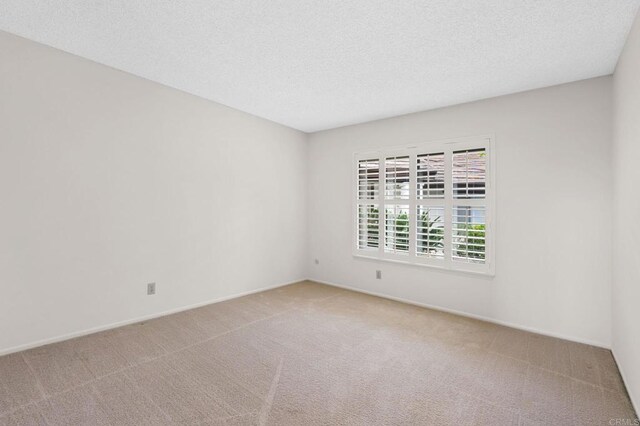 1109 Calle Del Baston, San Marcos, CA 92078 - spare room with carpet flooring and a textured ceiling