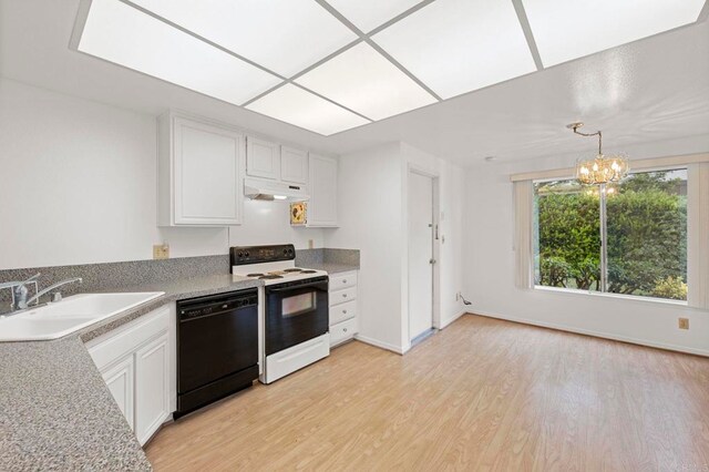 1109 Calle Del Baston, San Marcos, CA 92078 - kitchen with black dishwasher, electric range, under cabinet range hood, light wood-style flooring, and a chandelier