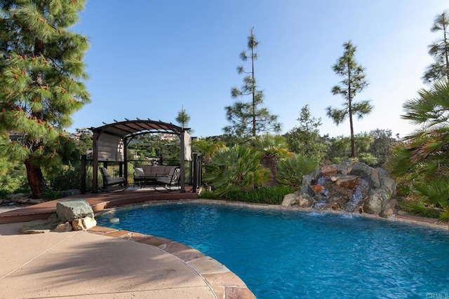pool featuring a patio and a pergola