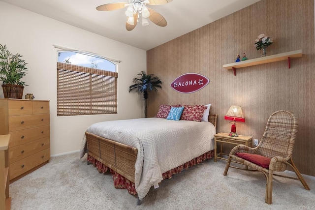 carpeted bedroom with baseboards and ceiling fan