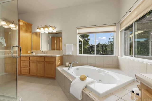 full bathroom with vanity, tile patterned floors, a shower stall, and a jetted tub
