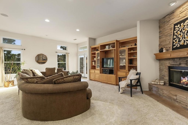 carpeted living room featuring a fireplace and recessed lighting