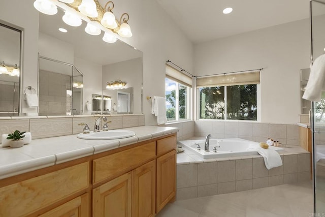 full bath featuring a tile shower, tile patterned flooring, vanity, a chandelier, and a garden tub