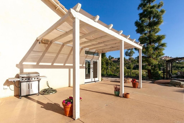 view of patio featuring a pergola and grilling area