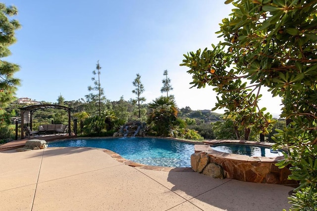 pool with a patio, an in ground hot tub, and a pergola