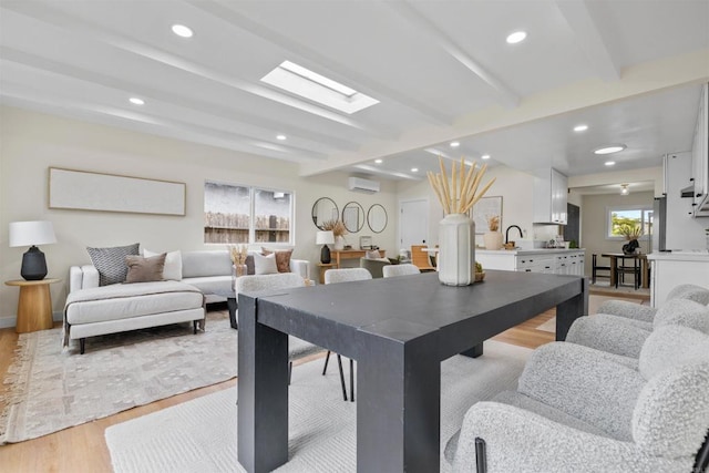 5061 Canosa Ave, San Diego, CA 92117 - dining room with recessed lighting, beamed ceiling, a wall mounted AC, and light wood-type flooring