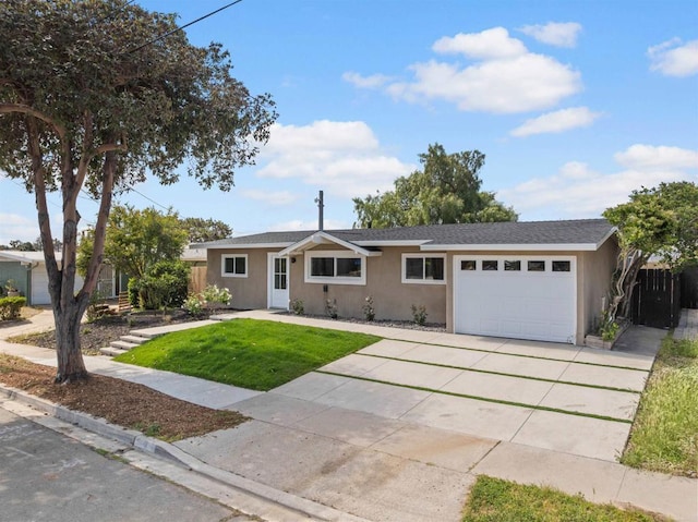 5061 Canosa Ave, San Diego, CA 92117 - ranch-style home featuring fence, an attached garage, a front lawn, stucco siding, and driveway