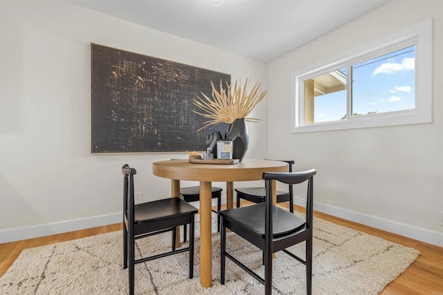 5061 Canosa Ave, San Diego, CA 92117 - dining area with baseboards and wood finished floors