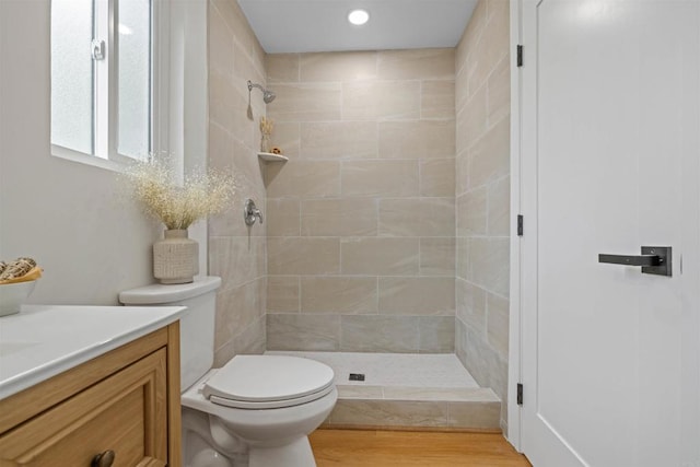 5061 Canosa Ave, San Diego, CA 92117 - bathroom with vanity, toilet, recessed lighting, wood finished floors, and tiled shower