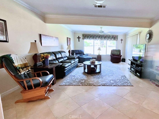 living room featuring ceiling fan, visible vents, light tile patterned floors, baseboards, and ornamental molding