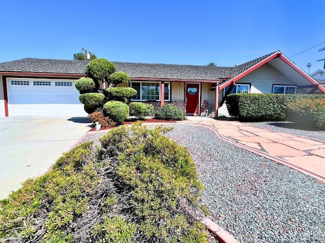 ranch-style house with a garage and concrete driveway