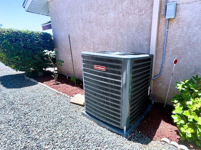 details with cooling unit and stucco siding
