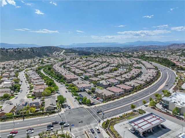 drone / aerial view featuring a residential view and a mountain view