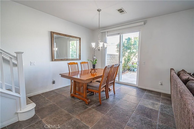 dining area with baseboards, a notable chandelier, stone tile flooring, and visible vents