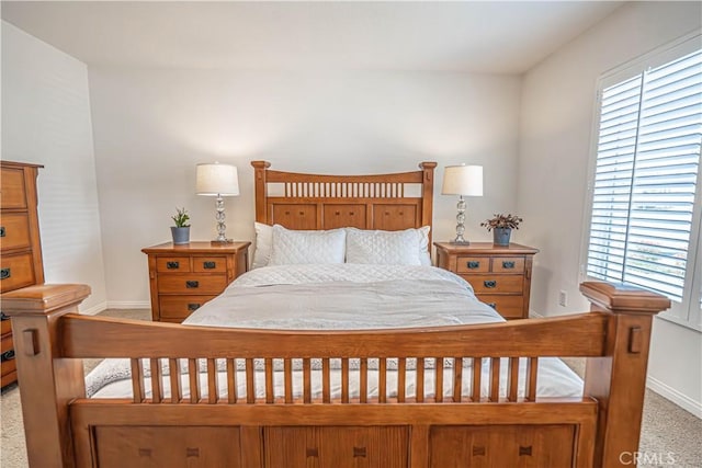 carpeted bedroom with baseboards