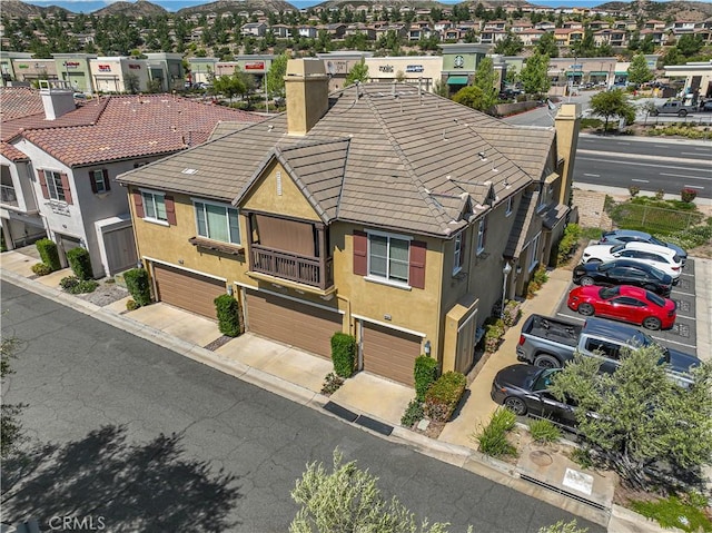 drone / aerial view with a residential view and a mountain view