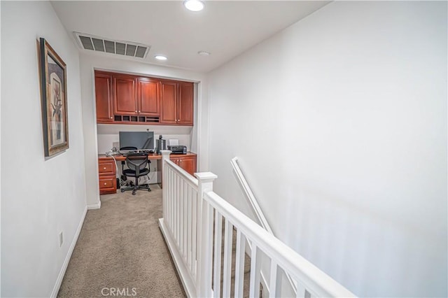 home office with light colored carpet, visible vents, built in study area, baseboards, and recessed lighting