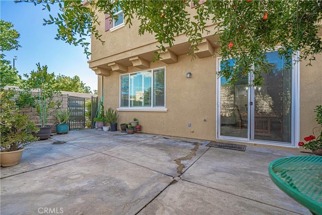 view of patio / terrace with fence and a gate