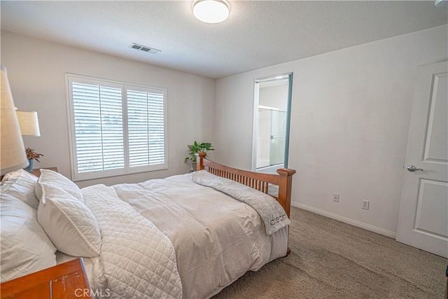 bedroom featuring baseboards, carpet, and visible vents