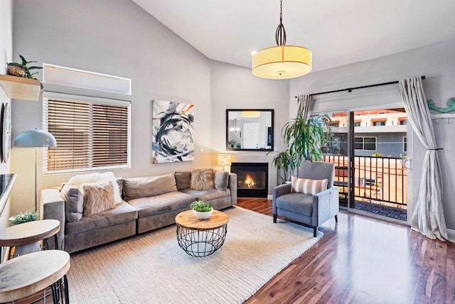 4658 Ohio St, San Diego, CA 92116 - living room with wood finished floors, a warm lit fireplace, and high vaulted ceiling