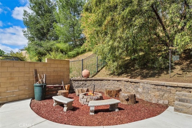 34787 Grotto Hills Dr, Winchester, CA 92596 - view of patio with a fenced backyard and an outdoor fire pit