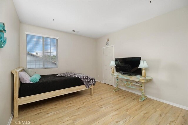 34787 Grotto Hills Dr, Winchester, CA 92596 - bedroom featuring baseboards, visible vents, and wood finished floors