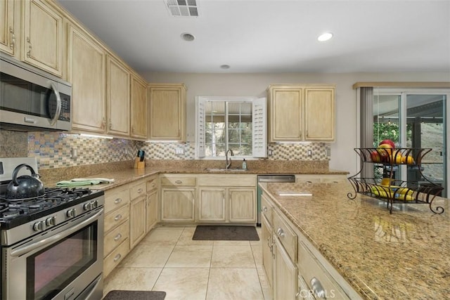 34787 Grotto Hills Dr, Winchester, CA 92596 - kitchen featuring a sink, light brown cabinets, stainless steel appliances, and visible vents