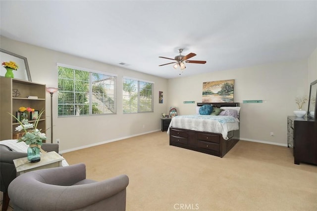 34787 Grotto Hills Dr, Winchester, CA 92596 - bedroom with baseboards, light carpet, a ceiling fan, and visible vents