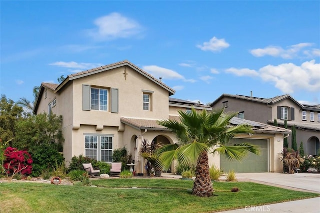34787 Grotto Hills Dr, Winchester, CA 92596 - mediterranean / spanish-style house featuring a tiled roof, driveway, solar panels, a front yard, and stucco siding