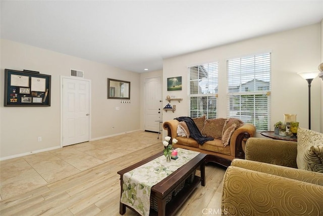 34787 Grotto Hills Dr, Winchester, CA 92596 - living area with visible vents, light wood finished floors, and baseboards