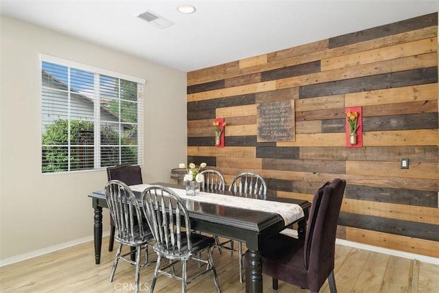34787 Grotto Hills Dr, Winchester, CA 92596 - dining room with baseboards, wood walls, wood finished floors, and visible vents