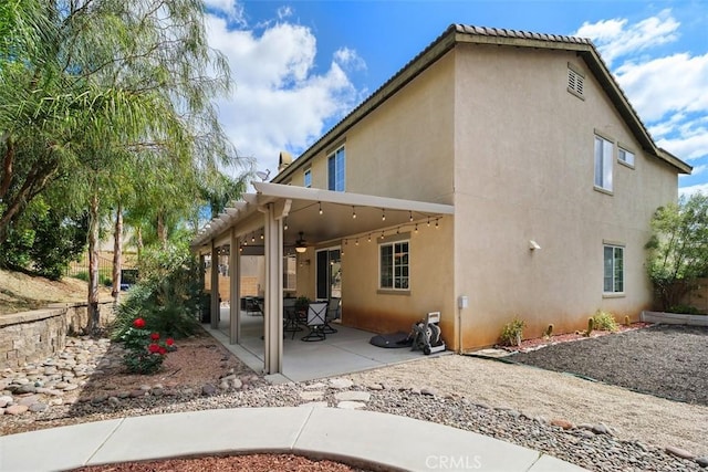 34787 Grotto Hills Dr, Winchester, CA 92596 - back of property with a patio, a ceiling fan, and stucco siding