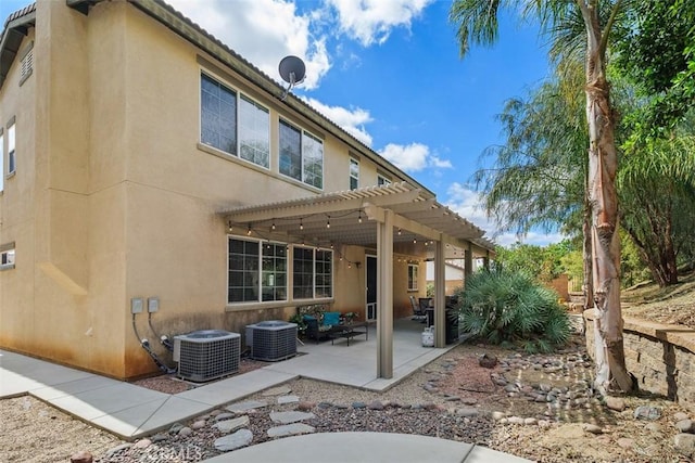 34787 Grotto Hills Dr, Winchester, CA 92596 - back of house with a pergola, stucco siding, cooling unit, and a patio area