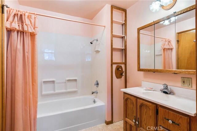 full bath featuring vanity and shower / bath combo