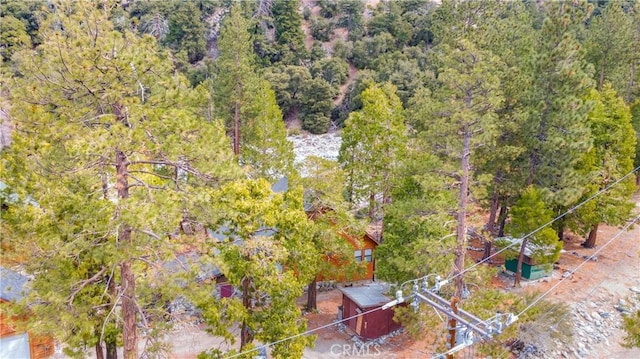 aerial view featuring a view of trees