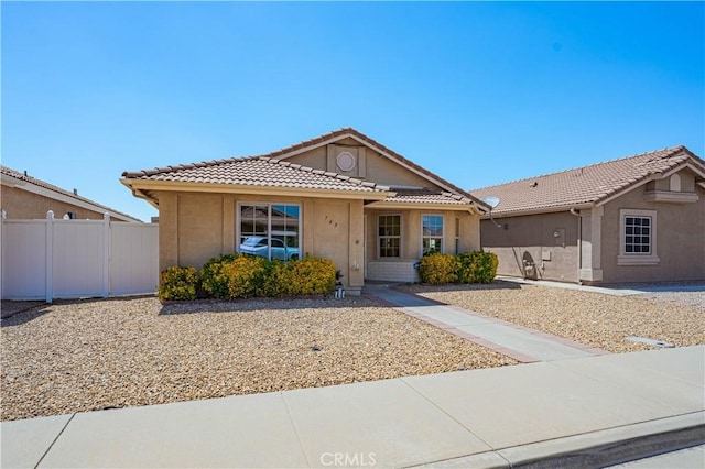 749 Cortez Dr, Hemet, CA 92545 - single story home featuring stucco siding, a tiled roof, and fence