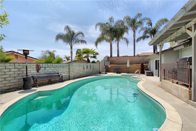 view of pool featuring a patio, a fenced in pool, and a fenced backyard