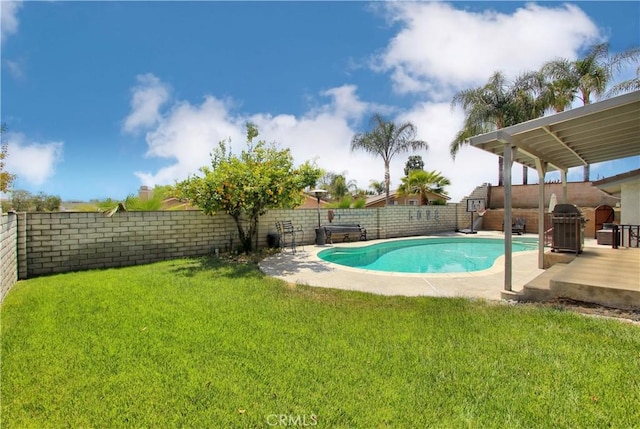 view of pool featuring a lawn, a fenced backyard, a patio area, and a fenced in pool