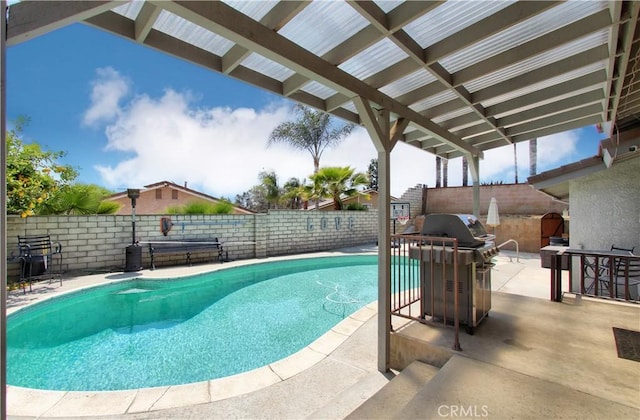 view of pool featuring grilling area, a fenced in pool, and a fenced backyard