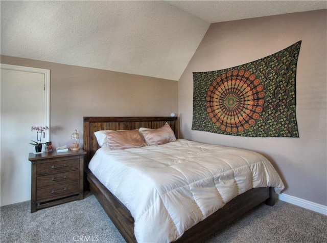 carpeted bedroom featuring a textured ceiling, baseboards, and vaulted ceiling