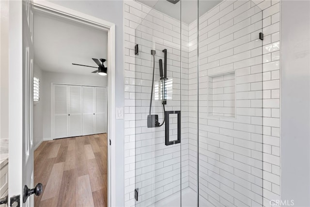 309 W Avenida Valencia, San Clemente, CA 92672 - full bathroom featuring a ceiling fan, a shower stall, and wood finished floors