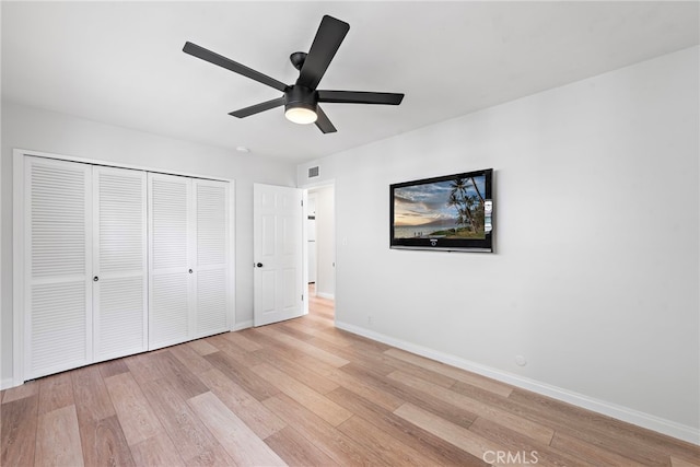 309 W Avenida Valencia, San Clemente, CA 92672 - unfurnished bedroom with a ceiling fan, baseboards, light wood-style flooring, and a closet