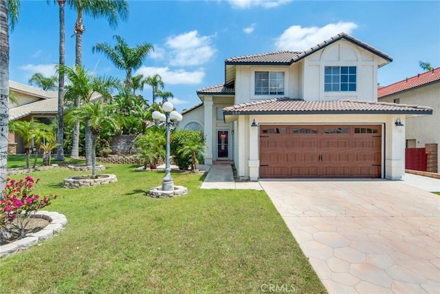 mediterranean / spanish home featuring concrete driveway, a tile roof, and stucco siding