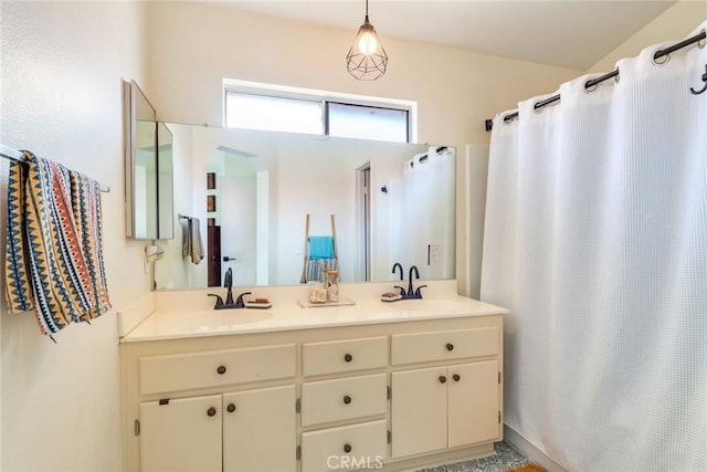 full bathroom featuring double vanity, a sink, and a shower with shower curtain